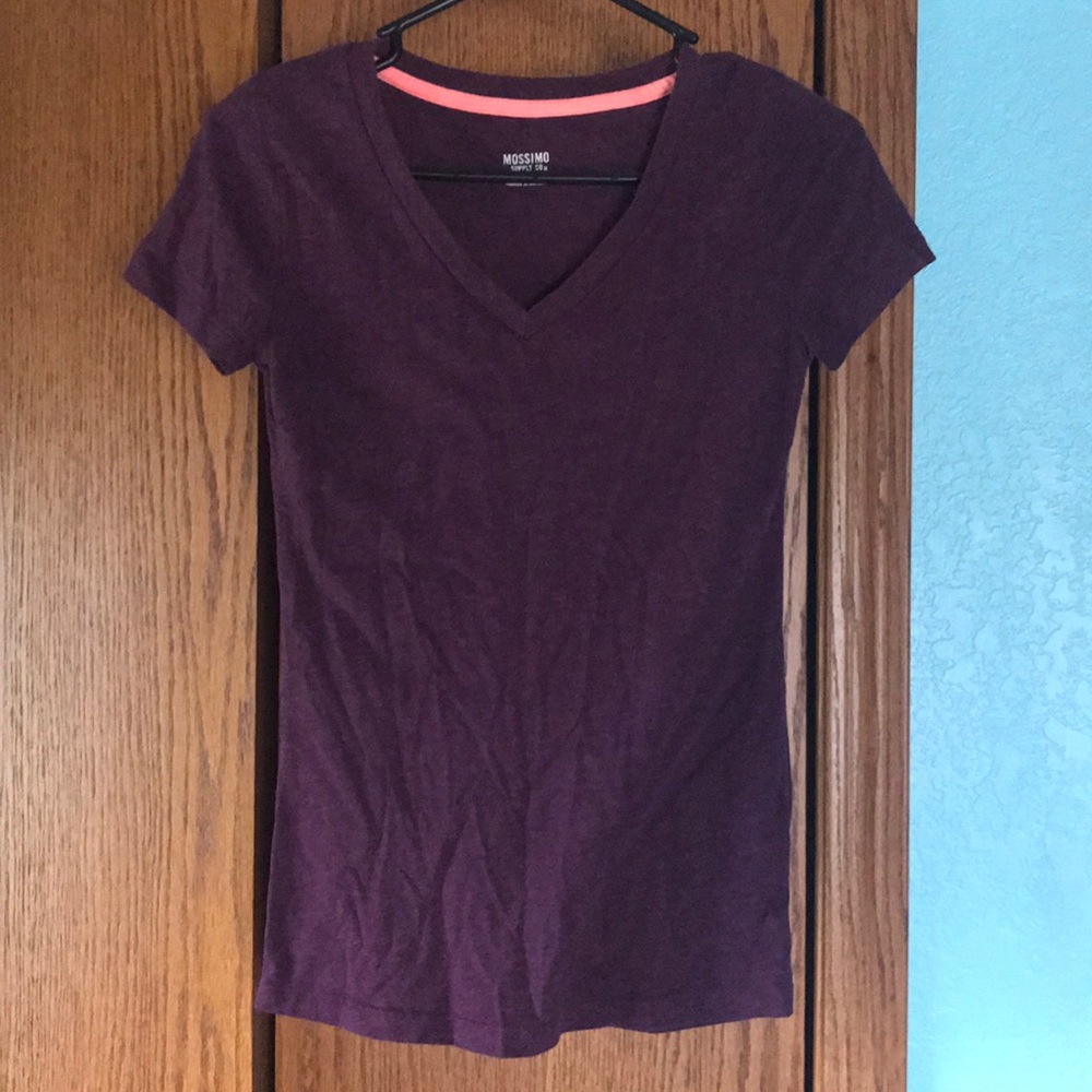 Purple/maroon colored short sleeve shirt.